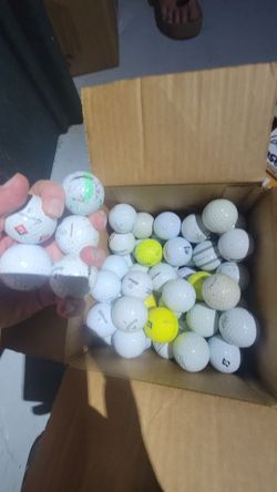 Assorted used golf balls. Random names and conditions.