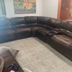 Used Couch Containing 3 Recliners And Cup holders 