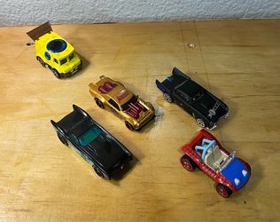 COLLECTION OF FIVE (5) DIE CAST HOT WHEEL CARS : • SpongeBob SquarePants Delivery Truck: A bright yellow vehicle on the top-left with a blue porthol