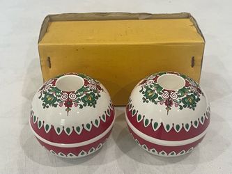 Pair of Takahashi Japanese porcelain spherical candle holders featuring folk art designs.
