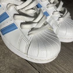 White and Baby blue superstar Adidas size 4