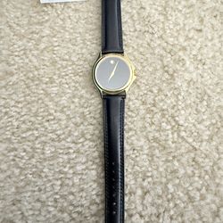 beautiful Unisex Movado watch with original box and accessories. New battery installed (7/3/25).