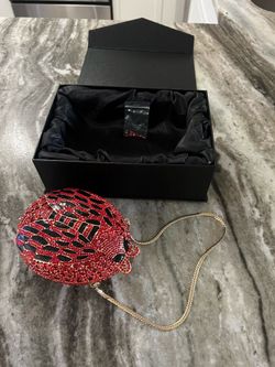 Ladybug hand clutch, hard shell entirely covered in red and black crystals