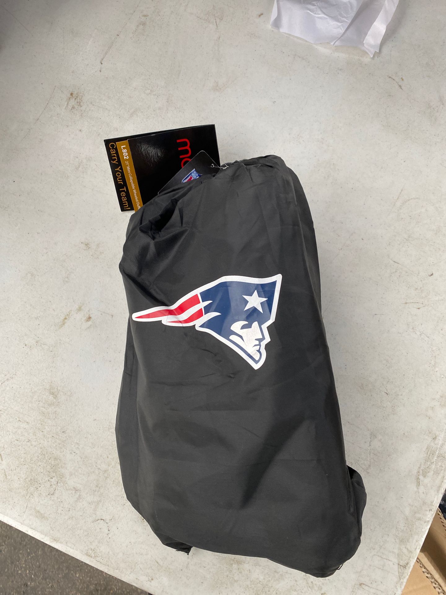 Brand new New England Patriots duffle bag and draw string backpack in one.