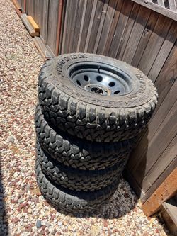 4 like new tires with rims 235/75/r15