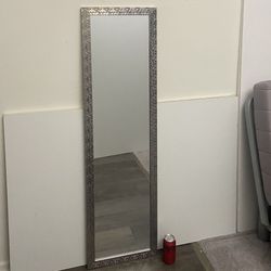 Full-Length Mirror in a sparkly mosaic chrome frame •H 50.5" x W 14.25" •mint condition •can be used vertically or horizontally