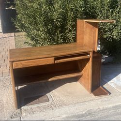 wooden desk, with bookshelf