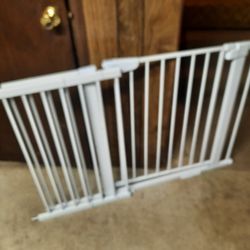 Baby gate fits in a small door space for a big space store.