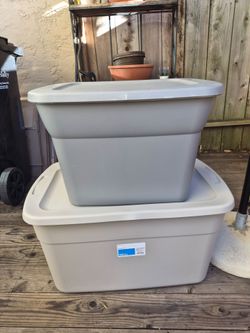 Two gray Storage bins with lids.