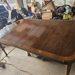 Kitchen Table.  60 Inches Long.  45 Inches Wide. 30 Inches High. Just got finished detailing it with two coats of clear lacquer on top cast iron wheel