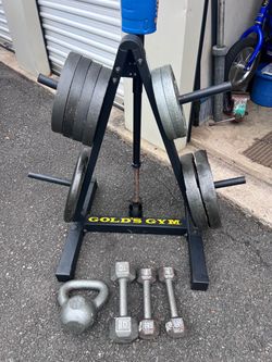 170 POUNDS SOLID WEIGHT PLATES PLUS A 25 POUND BAR AND STAND ALL FOR $245