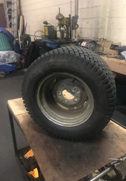 Bobcat older model spare tire and rim! Good tread and should hold air!