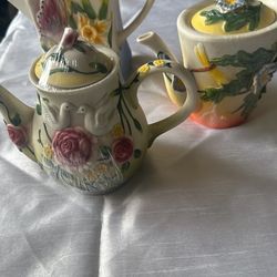 Vintage Teapots With Floral Detailing