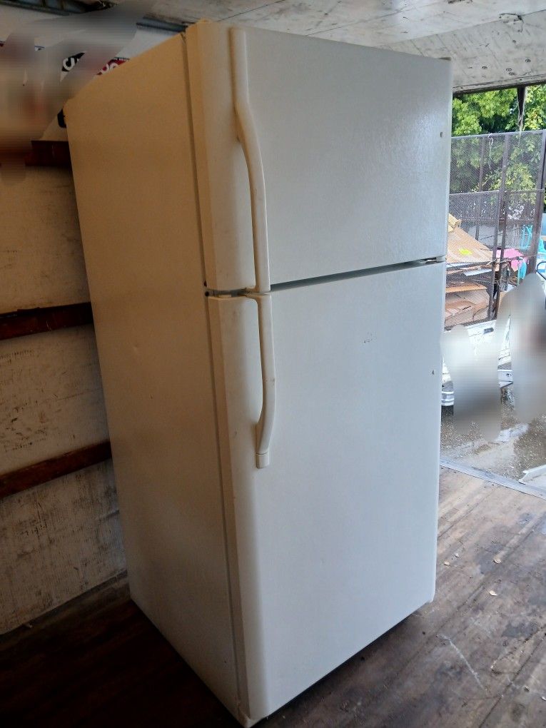 General Electric refrigerator. Works and cools very well.