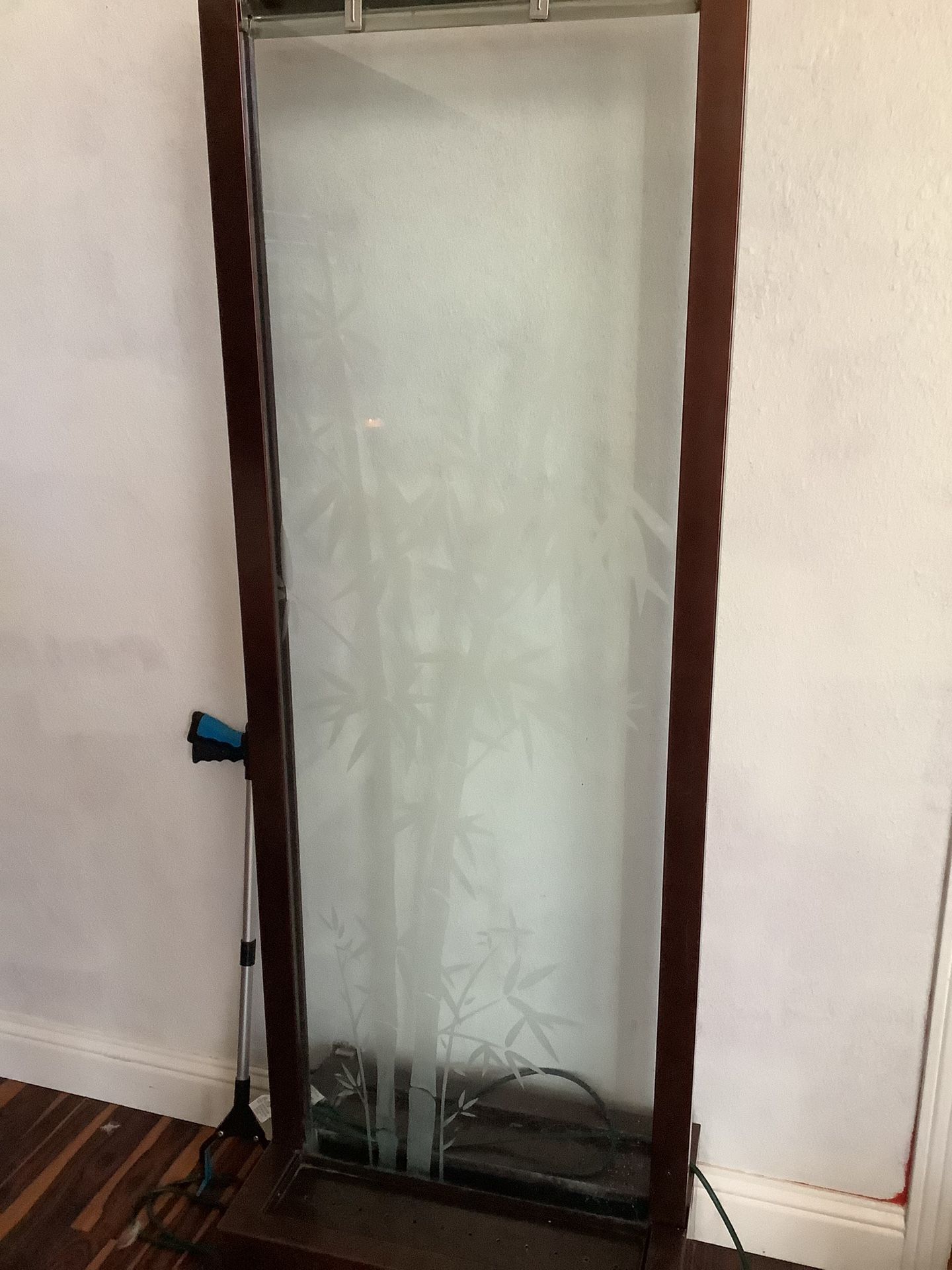 Water Fountain That Has Bamboo Etched Into Glass