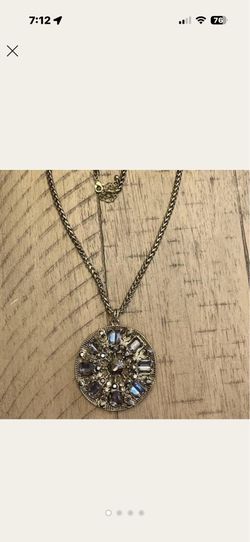 30 inch bronze toned long necklace with a round pendant.
