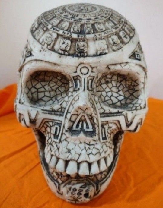 Vintage Reproduction Mesoamerican Maya Aztec Gods Skull Statue with Tribal Tattoo Figurine; Relief carvings around the entire skull.