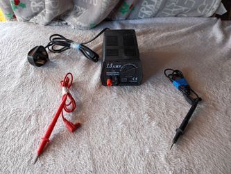Adjustable 1.5 Amp DC Power Supply with Red and Black Test Leads
