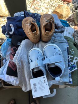 Box of baby boy clothes