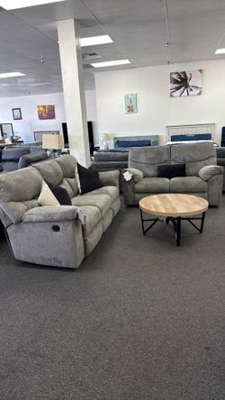 Ashley reclining grey sofa and love seat