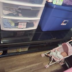 Black TV Stand And Bed With Bed Left Up