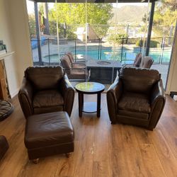 Two Leather Armchairs and Ottoman