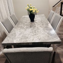 6 seater Dining table and chairs for sale. 78*40 Inches Marble top. Hardly used.