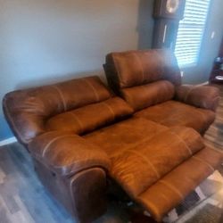 Leather Couch With Both Sides Recline Flat, Never Used Always Had Plastic On It 
