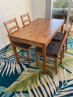 Dinner table with seats and cushions