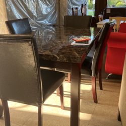 Brand new table and four chairs for 799