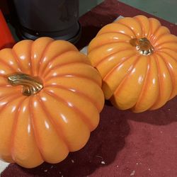 two large outdoor pumpkin decorations 