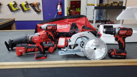 BRAND NEW MILWAUKEE 6 PIECE KIT COMES WITH SAW, SAWZAW,IMPACT, DRILL, MULTI TOOL, FLASHLIGHT CHARGER AND 2 BATTERIES