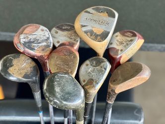Various vintage wood golf clubs