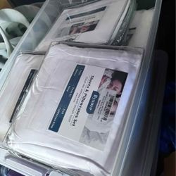 Bin of Queen Size Sheets and Pillowcases