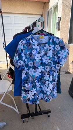 Floral or solid Print Scrub Top(size large) each $7