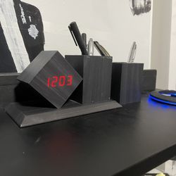 Digital alarm clock and pen holder 