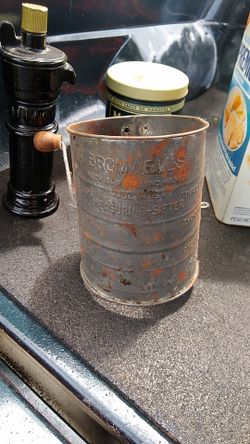 Vintage kitchen Bromwells sifter and tin cans