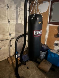 100lb heavy bag and stand like new!