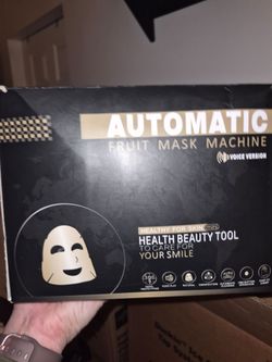 Automatic fruit mask machine