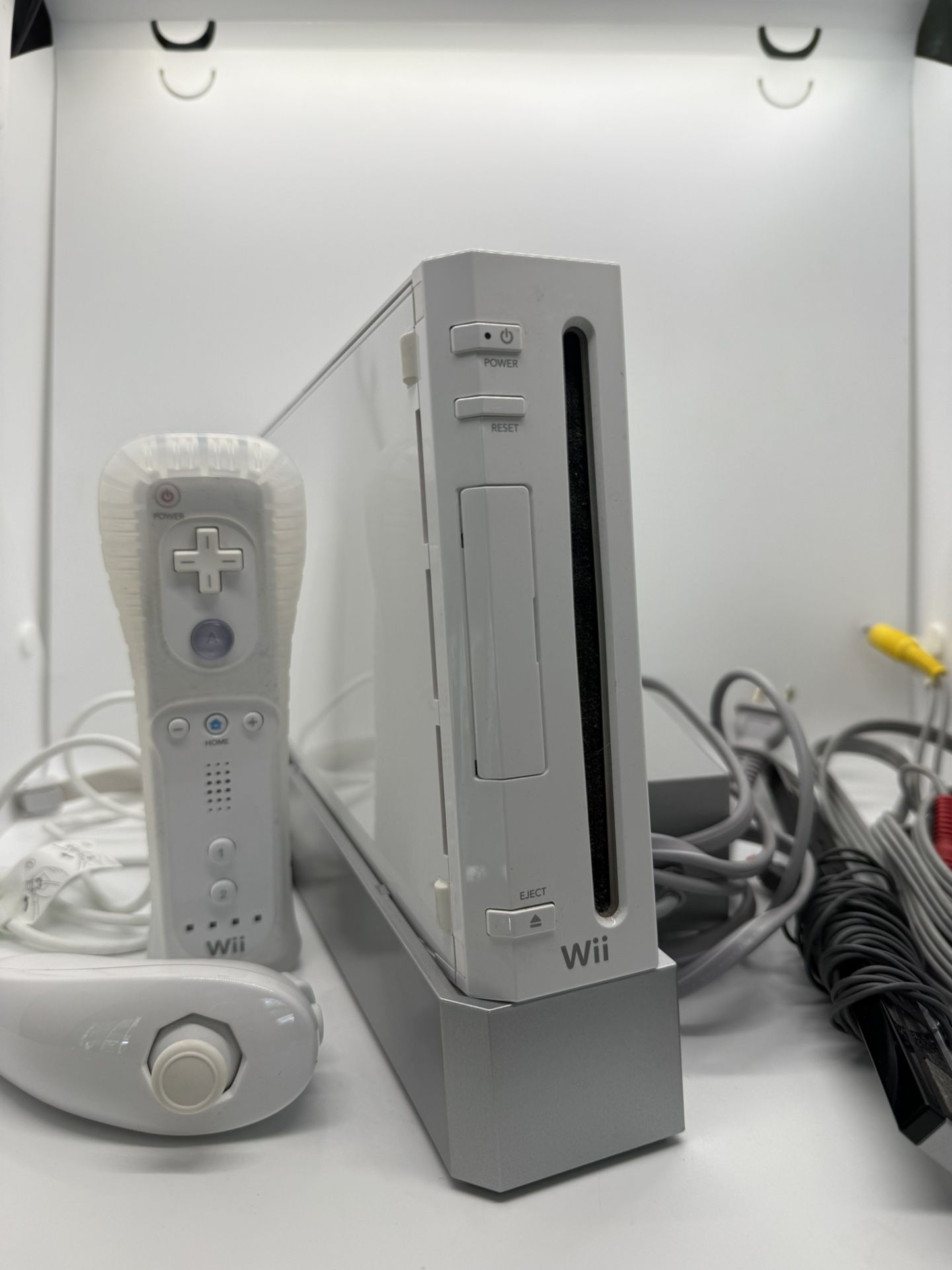 $95 for Nintendo Wii console & components & 1 remote & nunchuck / $195 with accessories & games- SEE NOTES
