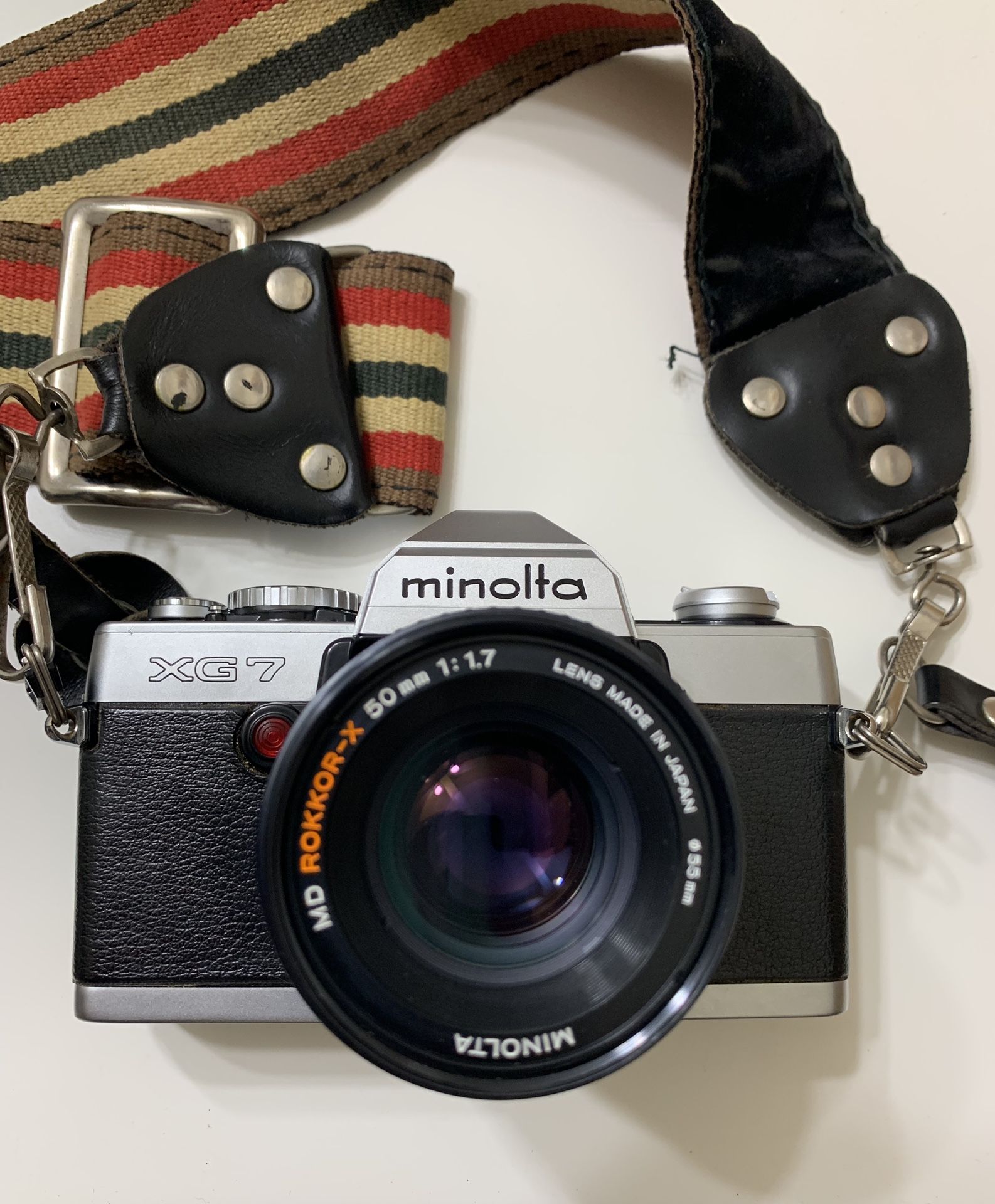 Minolta XG-7 35mm film camera with strap