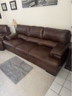 Brown leather couch by Abbyson