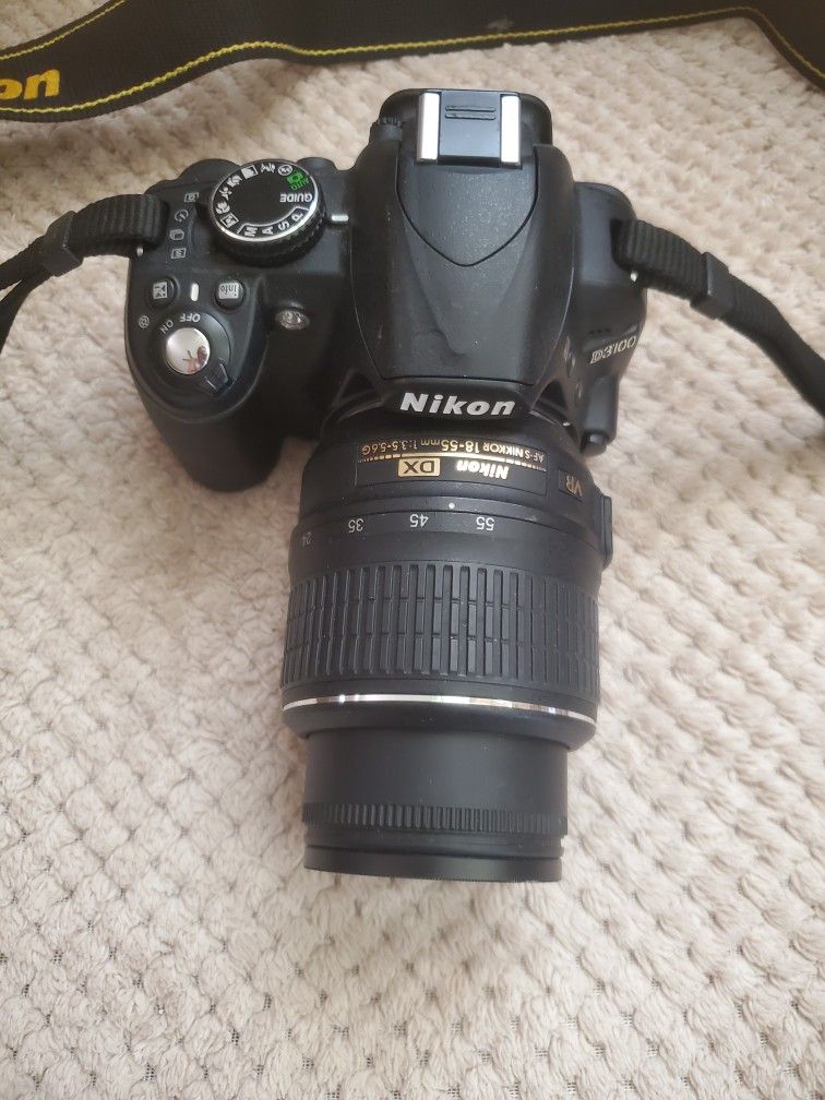 Nikon D 3100 With Extended Lens And Nikon Strap