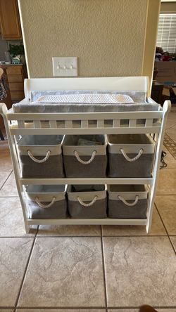 Baby changing table with storage boxes
