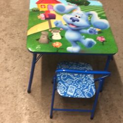 Almost brand new folding table with two chairs