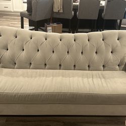 Gray Sofa and Love Seat with black buttons  
