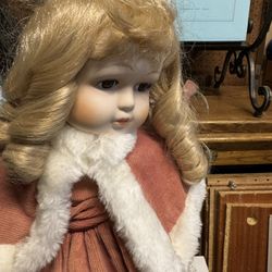 Vintage antique doll beautiful complete on a stand