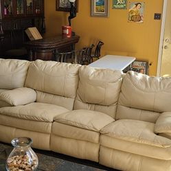 Cream Reclining Faux Lether Couch And Wedge In Good Condition  Free Come Pick It Up. 