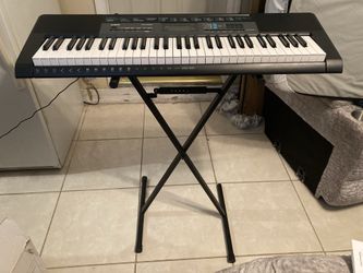 Casio keyboard with stand.