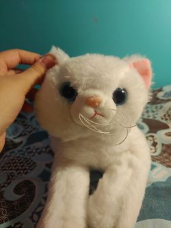 White cat stuffed animal embroidered paw pads